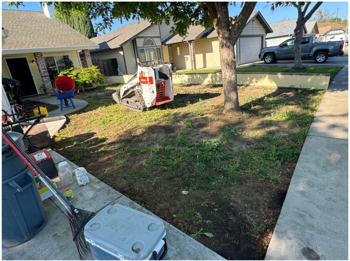Curved lawn & river rock installation — before