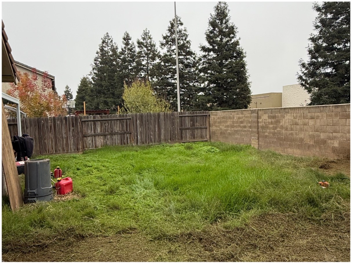 Gravel garden with raised beds — before